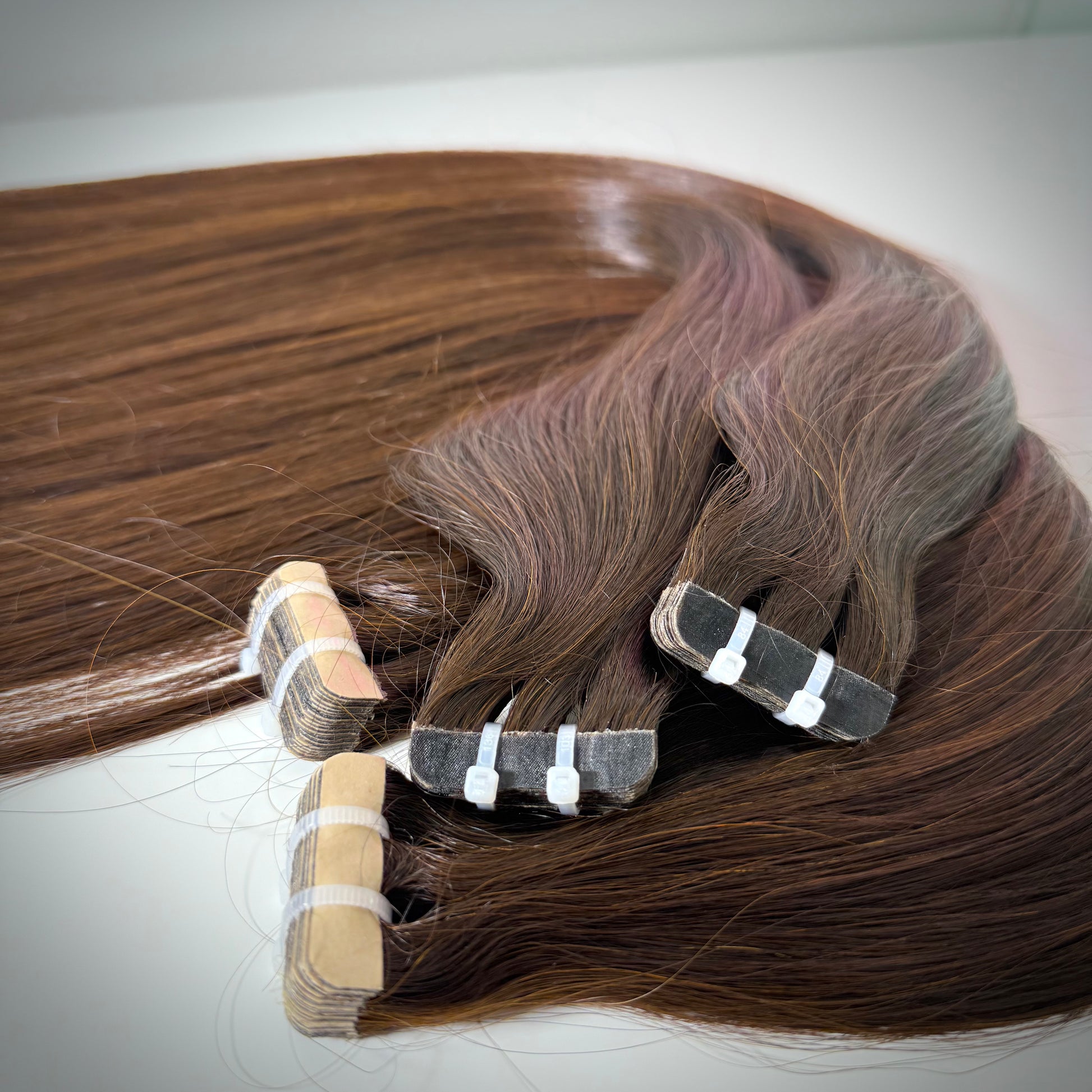 Raw Vietnamese tape-in hair extensions for sleek, natural looks in the UK and Ireland.