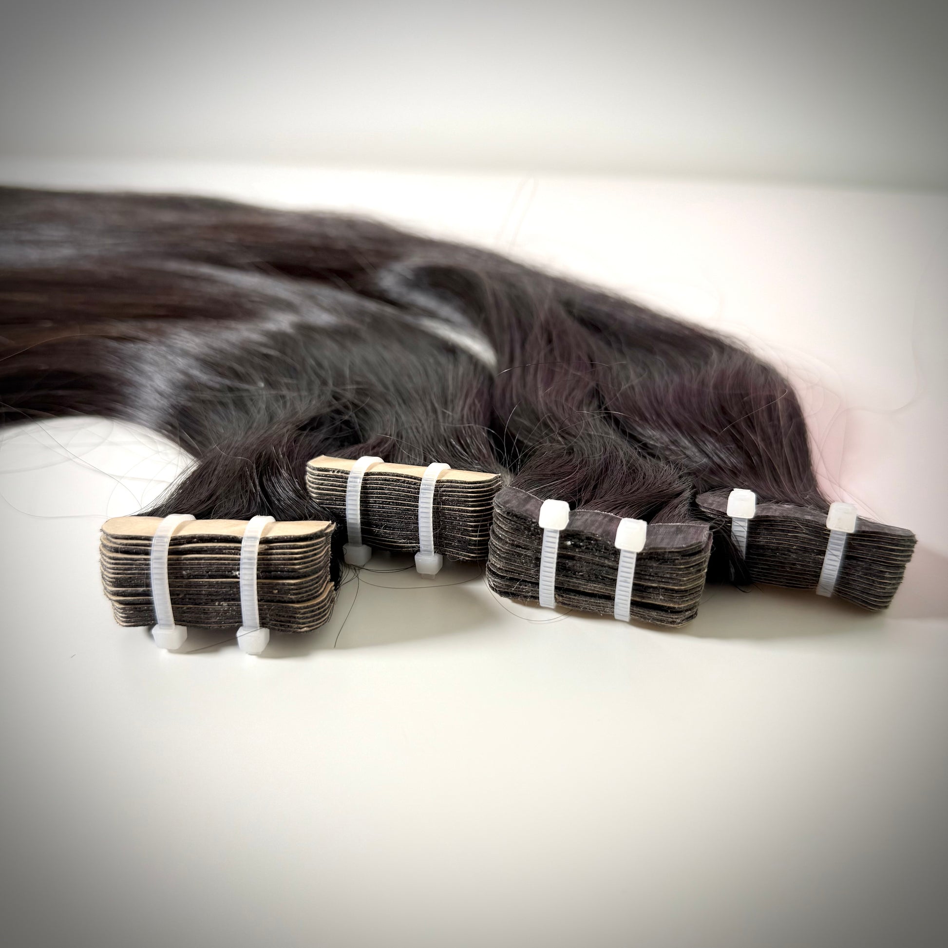 Raw Vietnamese tape-in hair extensions for sleek, natural looks in the UK and Ireland.