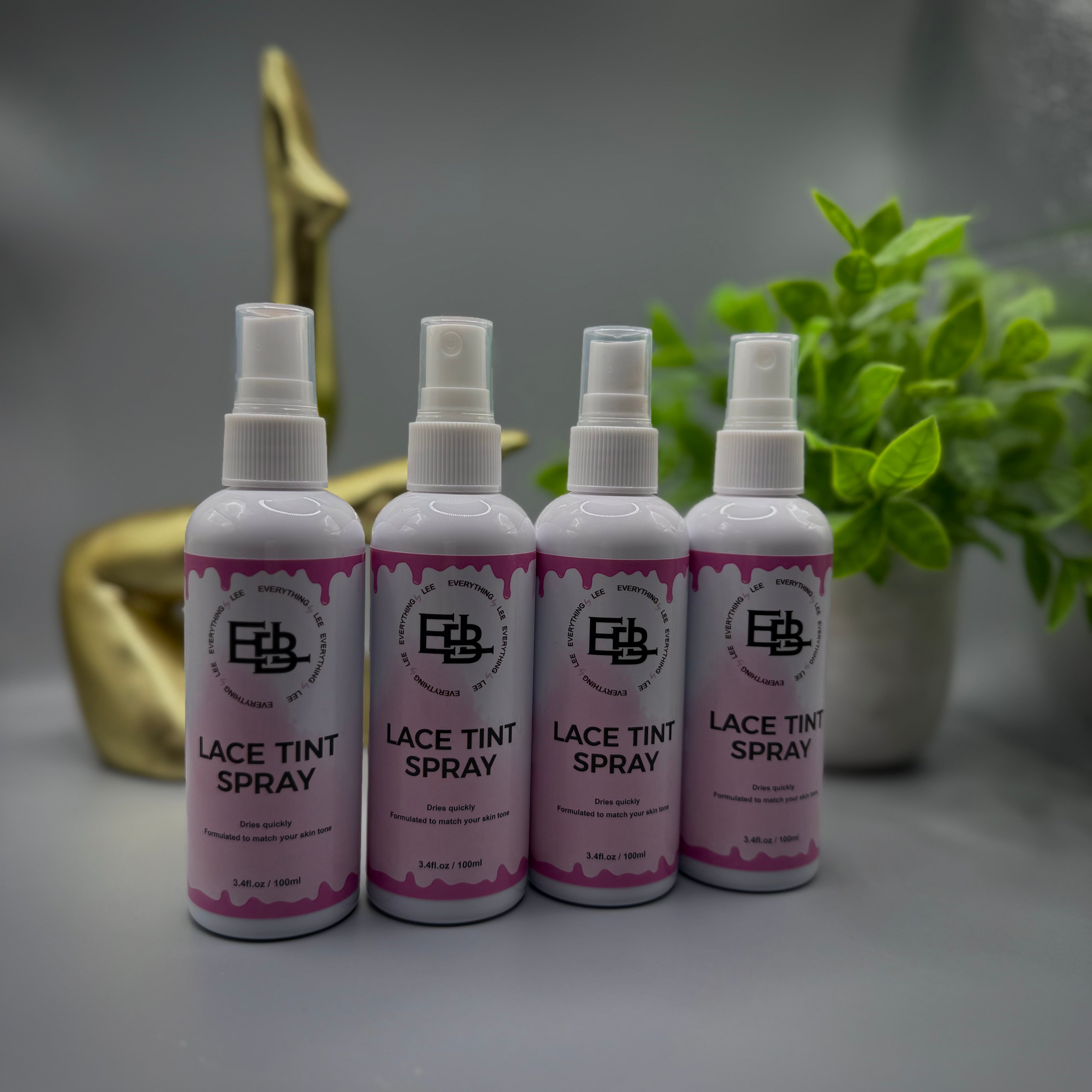Bottle of Lace Tint Spray in four skin tone shades