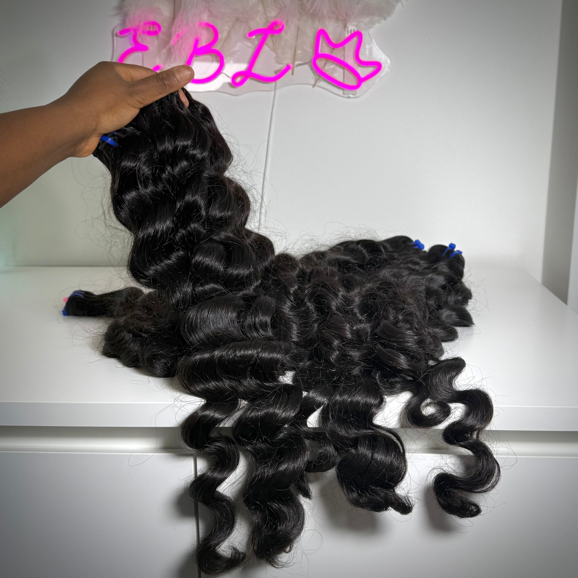 100% raw loose wavy human hair bundle with soft flowing waves – thick, natural texture ideal for sew-ins, custom wigs, and natural-looking installs