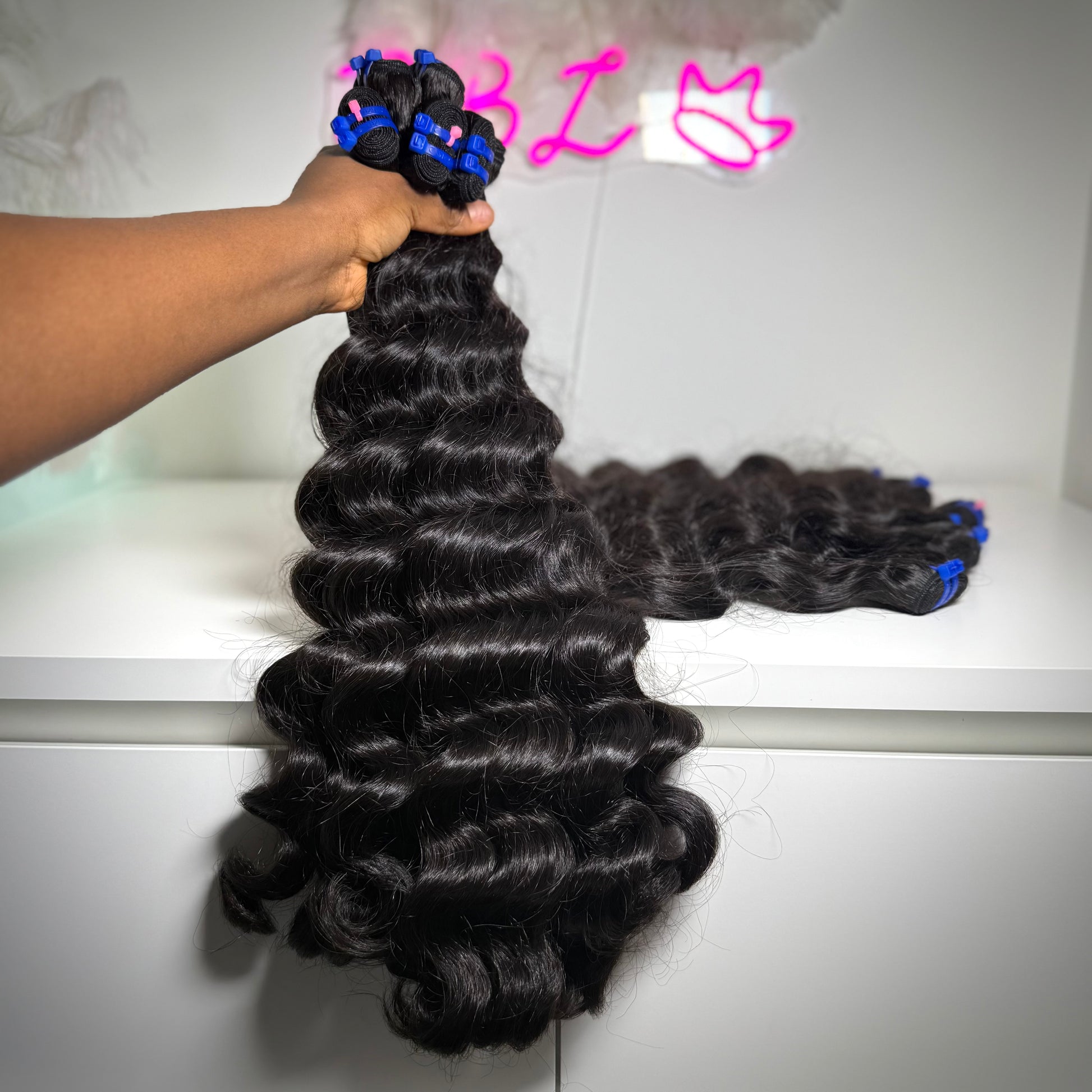 100% raw loose wavy human hair bundle with soft flowing waves – thick, natural texture ideal for sew-ins, custom wigs, and natural-looking installs