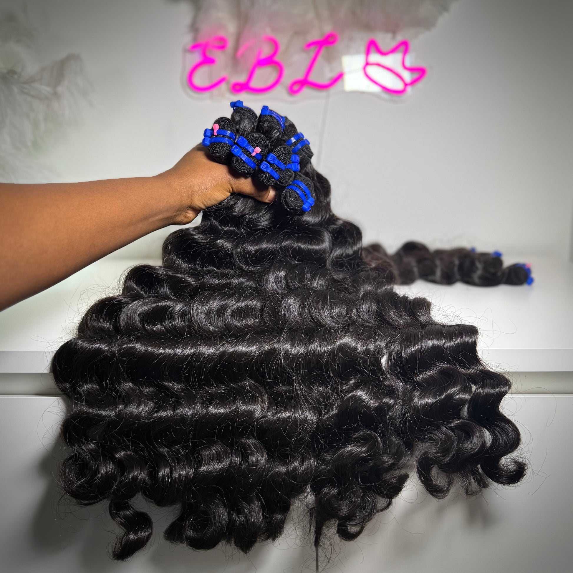 100% raw loose wavy human hair bundle with soft flowing waves – thick, natural texture ideal for sew-ins, custom wigs, and natural-looking installs