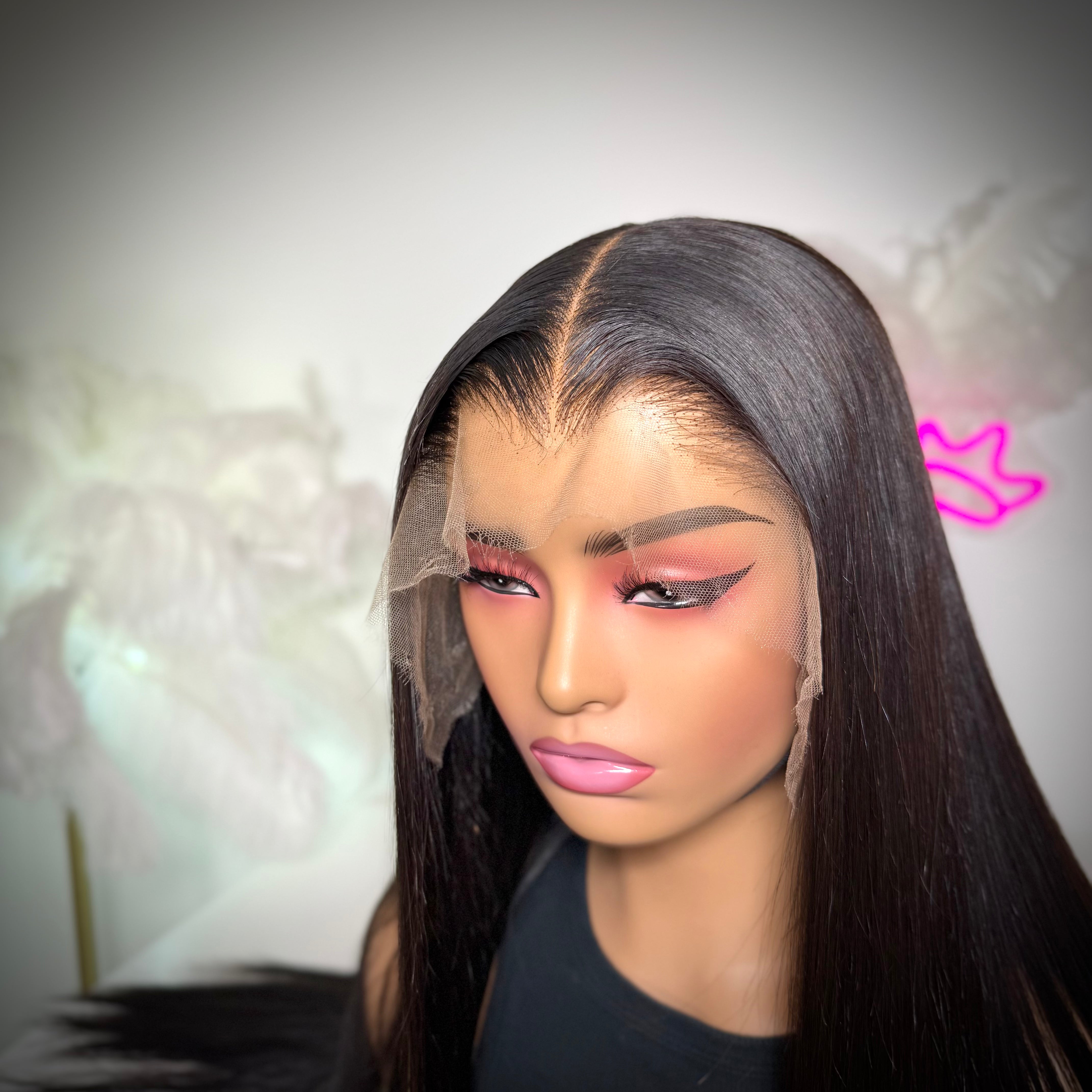 Person wearing a lace front wig with a blurred background